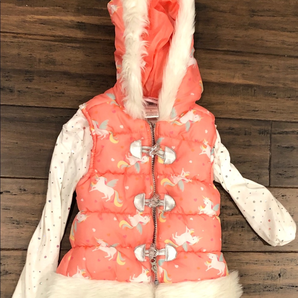 This two piece set has a pink vest and white shirt